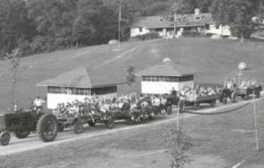 http://www.kyforward.com/wp-content/uploads/2018/06/Tractor-ride-Camp-Ernst-1950-300x190.jpg